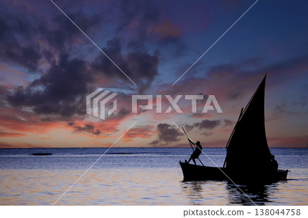 sailboat at sunset in Mauritius island sailboat at sunset in Mauritius island 138044758