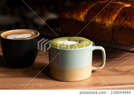 Coffee cups with delicious bread on a wooden table 138044944