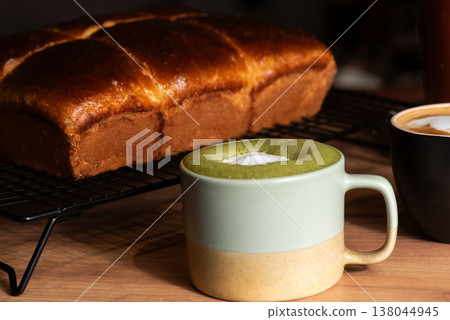 Coffee cups with delicious bread on a wooden table 138044945