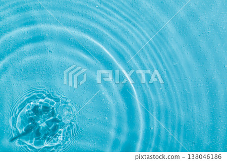 drops on water with circles on a blue background drops on water with circles on a blue background 138046186