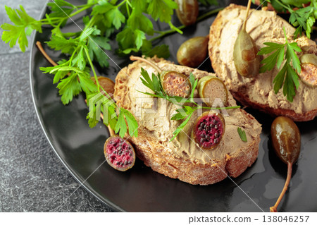 Bread with liver pate, capers, and fresh parsley. Bread with liver pate, capers, and fresh parsley. 138046257