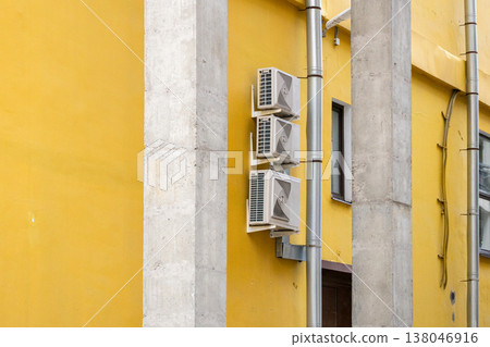 air conditioning on facade of building, air cooling in hot weather.  138046916