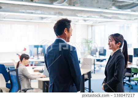 A woman interning in a modern office. A woman interning in a modern office. 138047217