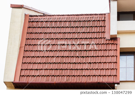 Close-up view of a red tiled roof and terracotta tiles Close-up view of a red tiled roof and terracotta tiles 138047299