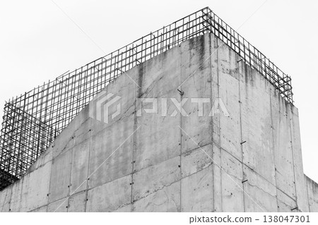 A concrete building corner with exposed rebar grid A concrete building corner with exposed rebar grid 138047301