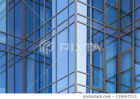 Modern blue glass facade of an office building Modern blue glass facade of an office building 138047313