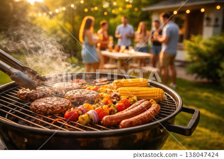 A barbecue grill filled with meat, sausages, and vegetables in a sunny backyard, while a group of friends gathers and socializes in the background A barbecue grill filled with meat, sausages, and vegetables in a sunny backyard, while a group of friends gathers and socializes in the background 138047424