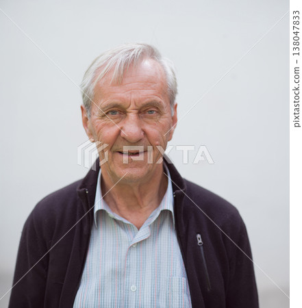 Elderly grandfather portrait representing family and three generations with warm expression and neutral background Elderly grandfather portrait representing family and three generations with warm expression and neutral background 138047833
