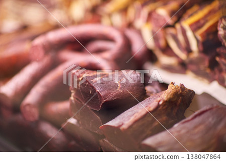 Assorted cured meats and sausages on display sliced dried beef and charcuterie selection 138047864