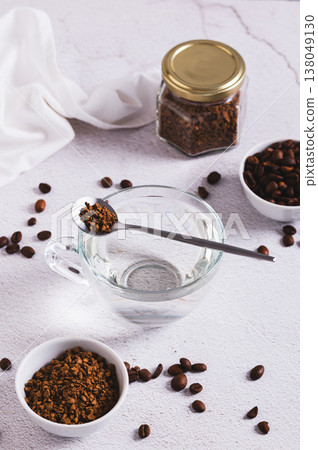 Concept of choosing between coffee beans and instant coffee on the table vertical view 138049130