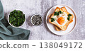 Baked toast with egg and parsley on a plate on the table top view web banner 138049172