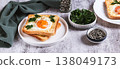An egg baked in pieces of bread on a plate on the table web banner 138049173