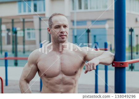 A CrossFit man poses for the camera on a sports A CrossFit man poses for the camera on a sports 138049296
