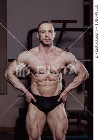 Bodybuilder posing in the gym, aesthetic body Bodybuilder posing in the gym, aesthetic body 138049310