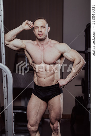 Bodybuilder training in the gym, aesthetic body Bodybuilder training in the gym, aesthetic body 138049333
