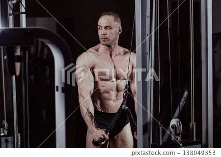Bodybuilder training in the gym, aesthetic body Bodybuilder training in the gym, aesthetic body 138049353