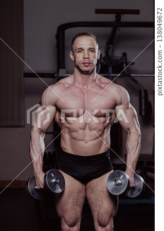 Bodybuilder training in the gym, aesthetic body Bodybuilder training in the gym, aesthetic body 138049672