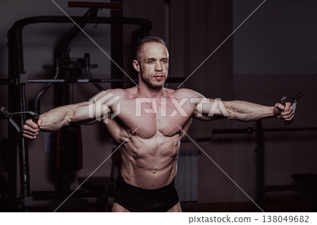 Bodybuilder training in the gym, aesthetic body Bodybuilder training in the gym, aesthetic body 138049682