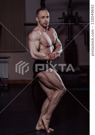 Bodybuilder posing in the gym, aesthetic body Bodybuilder posing in the gym, aesthetic body 138049692