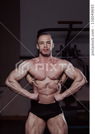 Bodybuilder posing in the gym, aesthetic body Bodybuilder posing in the gym, aesthetic body 138049693