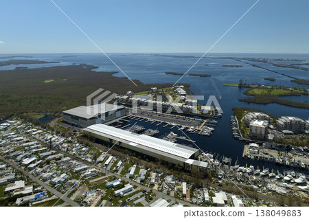 Warehouse with motorboats and yachts destroyed by hurricane winds in Florida coastal area. Natural disaster and its consequences 138049883