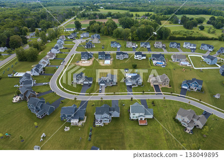 View from above of residential houses in living area in Rochester, NY. American dream homes as example of real estate development in US suburbs View from above of residential houses in living area in Rochester, NY. American dream homes as example of real estate development in US suburbs 138049895