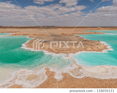 The island-like topography and turquoise waters of the Siwa Oasis salt lake. The island-like topography and turquoise waters of the Siwa Oasis salt lake. 138050131
