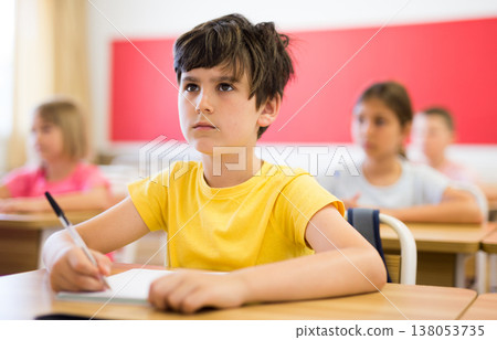 Boy sitting in classroom 138053735