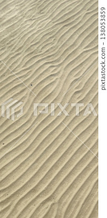 The ribbed texture of sand on the bottom or shore of a body of water The ribbed texture of sand on the bottom or shore of a body of water 138053859