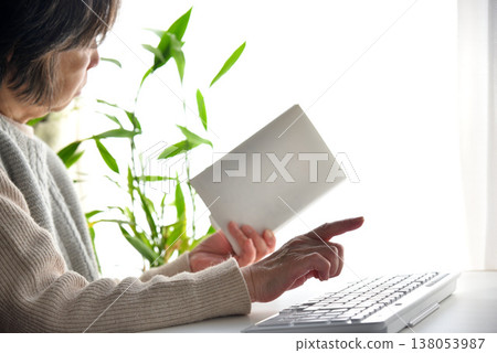 Image of a senior citizen struggling with computer operation. Image of a senior citizen struggling with computer operation. 138053987