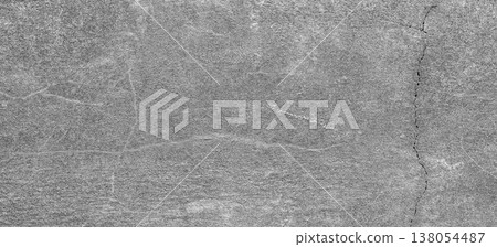 Textured gray concrete surface with visible cracks and variations, suitable for backgrounds, design projects, and architectural applications 138054487