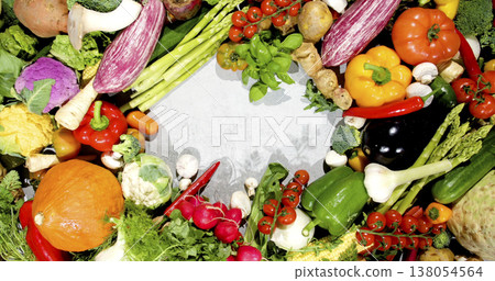 Fresh vegetables arranged on a table ready for cooking and meal preparation in a kitchen setting Fresh vegetables arranged on a table ready for cooking and meal preparation in a kitchen setting 138054564