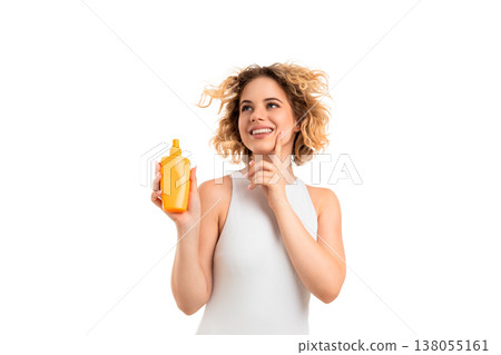 Girl smiles and holds sunscreen with curly hair, PNG 138055161