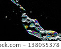 The image of splashes and bubbles of soap that shimmer in rainbow colors. 138055378