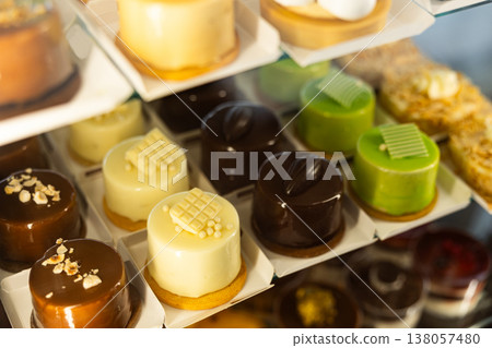 Mousse and mini cakes on display Mousse and mini cakes on display 138057480