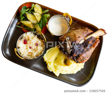 Long cooked meat served with mashed potatoes, cabbage and sauce Long cooked meat served with mashed potatoes, cabbage and sauce 138057505