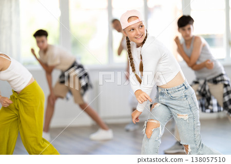 Teenage girl dancing hip hop in group Teenage girl dancing hip hop in group 138057510