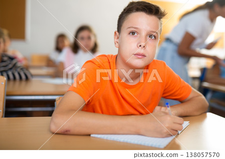 Young boy learning in school Young boy learning in school 138057570