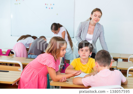 Schoolchildren performing team tasks Schoolchildren performing team tasks 138057595