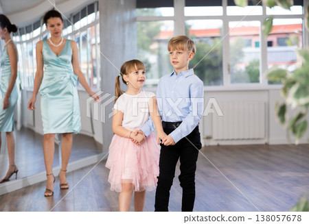Boy and girl train to dance contemporary vigorous rumba during classes. 138057678