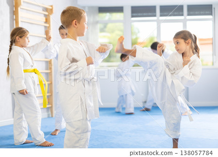 Karate students engage in sparring Karate students engage in sparring 138057784