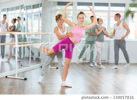 Ballet training for teenagers in a ballet studio under the guidance of choreographer Ballet training for teenagers in a ballet studio under the guidance of choreographer 138057816