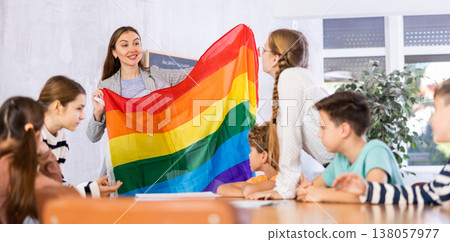 Teacher showing transgender flag to group of schoolchildren Teacher showing transgender flag to group of schoolchildren 138057977