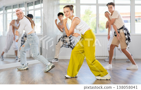 Teen girl with group of teenage friends, learn to dance hip hop 138058041