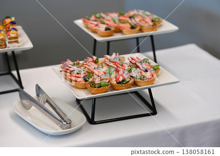 Assorted catering dessert with strawberry and blueberry fruit tart on buffet table for event or party decoration with no people and copy space sweet 138058161