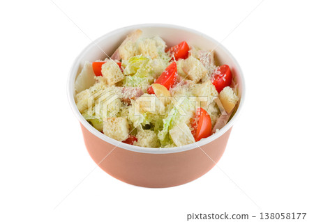Fresh caesar salad with chicken crouton and cherry tomato in craft paper take out bowl on white background side view close up with copy space Fresh caesar salad with chicken crouton and cherry tomato in craft paper take out bowl on white background side view close up with copy space 138058177