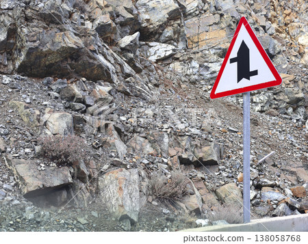 Warning Sign Beside Rocky Mountain Road 138058768