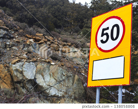 Yellow Mountain Road Speed Limit Sign Closeup 138058808