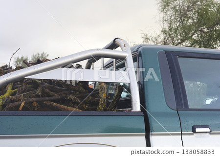 Green Pickup Truck Loaded With Firewood And Logs Green Pickup Truck Loaded With Firewood And Logs 138058833