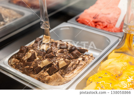 Ice cream in showcase fridge at pastry cafe Ice cream in showcase fridge at pastry cafe 138058866